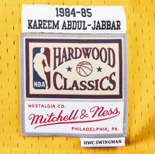MITCHELL & NESS KAREEM ABDUL-JABBAR 1983-84 YELLOW SWINGMAN JERSEY